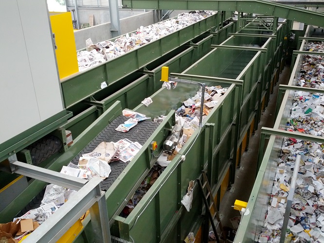 Parallel sorting conveyors carrying mixed recyclable material
